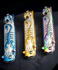 Folding Pocket Knife With 3D Titanium Plated Scorpion Handle Dope Rainbow Finish on dark background