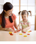 Mother and child engaging with Super Awesome Red And Yellow Counting Blocks Pack Of 200 at a table, promoting hands-on learning.