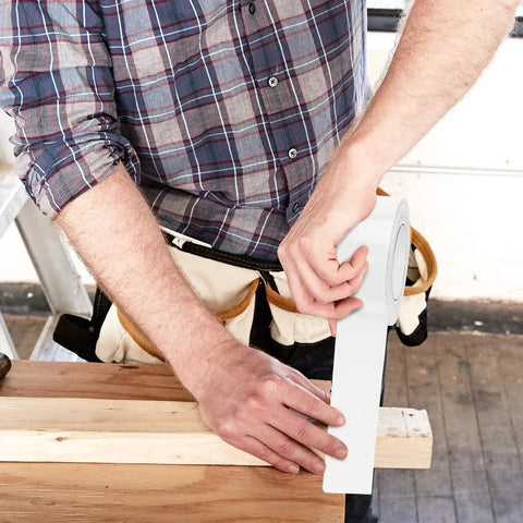 Man using White Duct Tape Heavy Duty Waterproof 40 Yards By 2 Inches 9 Mils Thick With Strong Adhesive No Residue Easy Tear By Hand