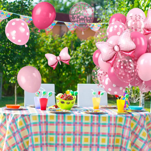 Party setup with Pink Bow Balloons Kit includes 30 pieces of 12 inch balloons in hot pink rose dots and confetti styles plus two big foil bow balloons.