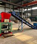 Heavy Duty Concrete Block Making Machine For Industrial Brick Production with red hopper and conveyor for fast output.