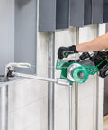 Greenlee G1 Versi-Tugger Handheld Cable Puller in use, pulling wire through conduit with ergonomic handling.