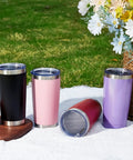 Eight Tough As Nails Twenty Ounce Double Wall Insulated Stainless Steel Tumblers With Secure Lids And Straws That Keep Your Sippin Frosty Or Steaming Hot All Day Long In Sleek Black Finish showcased on a picnic blanket.