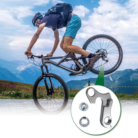 Cyclist riding with Universal Bicycle Derailleur Hanger For Road And MTB Bikes Aluminum Alloy Durable Replacement Fits various frames