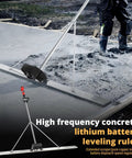 Pro Grade Cordless Concrete Screed Vibrator With 59 Inch Stainless Steel Straight Edge Board in use on a wet concrete slab.