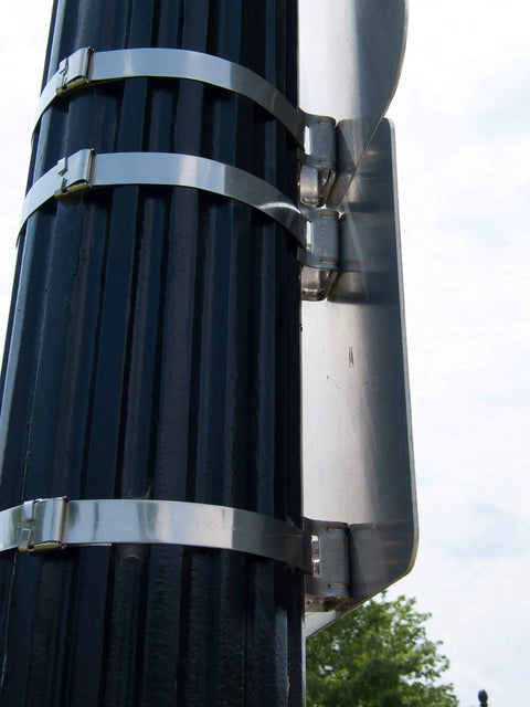 Stainless Steel Bull's Eye Sign Mounting Brackets With Straight Leg and Washer on post, supporting a traffic sign