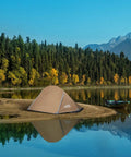 Lightweight 1 Person Tent For All Seasons, Windproof, Rainproof And Waterproof Camping Tent beside a lake with mountain backdrop