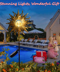 Sun Powered Solar Garden Light Stake With Crackle Glass Metal Finish illuminating a patio by the pool at night.