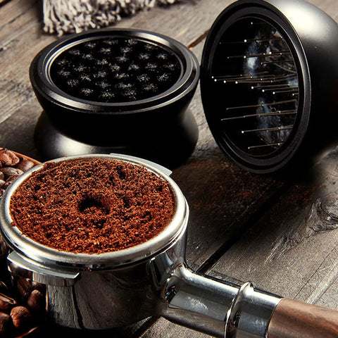Pro Level 58mm Coffee Powder Distributor And Espresso Stirrer Tool featuring adjustable height dial on wooden table with coffee grounds.