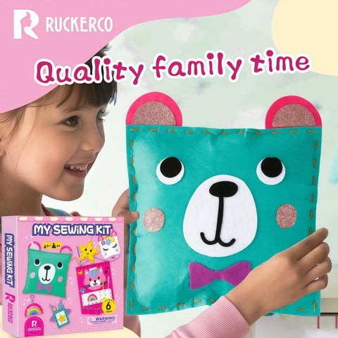 Child holding a completed bear pillow from the Kids Sewing Kit For Beginners With 6 Easy Felt Projects Learn To Sew Craft Kit.