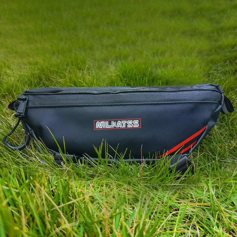 Waterproof Handlebar Tool Bag Made With PVC Tarpaulin For Dirt Bikes That Fits Sur Ron Segway Talaria Off Road Rides And Keeps Your Essentials Dry In Wet Weather Ready For Any Trail Or Wet Conditions. black PVC tarpaulin handlebar bag shown on grass, side view