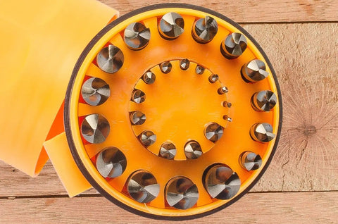 29 Piece Drill Bit Set With 135 Degree Split Point, Jobber Length, Orange And Gold Finish, Sizes 1/16 To 1/2 Inch on wood table