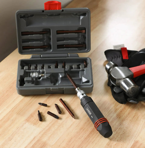 Beefy Half Inch Drive Hex Grip Impact Driver Kit with quarter and five sixteenth inch bit chucks and storage case on workbench.