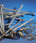 Five Sixteenth Inch External Tooth Lock Washer Set Twenty Pieces 304 Stainless Steel washers and screws on blue surface