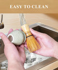 Washing Pro Grade Matcha Whisk Set With 76 Prong Chasen, ceramic mottled green stand under faucet in kitchen sink