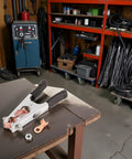 Heavy Duty 500A Welding Ground Clamp with Rubber Sleeve and Insulated Handle on workbench in welding shop