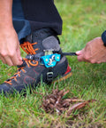Person securing Foot Ascender With Toothless Dual Cams For Reduced Wear And Drag On Climbing Line Use On Either Foot Self Tending Design