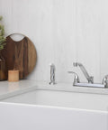 Two Handle Kitchen Faucet With Side Spray In Polished Chrome mounted on a white kitchen sink, modern high arc design visible.