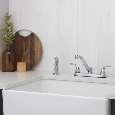 Two Handle Kitchen Faucet With Side Spray In Polished Chrome mounted on a white kitchen sink, modern high arc design visible.
