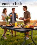 Friends enjoying a meal on a Six Foot Folding Table With Carrying Handle That's Built Tough For Indoor And Outdoor Parties.