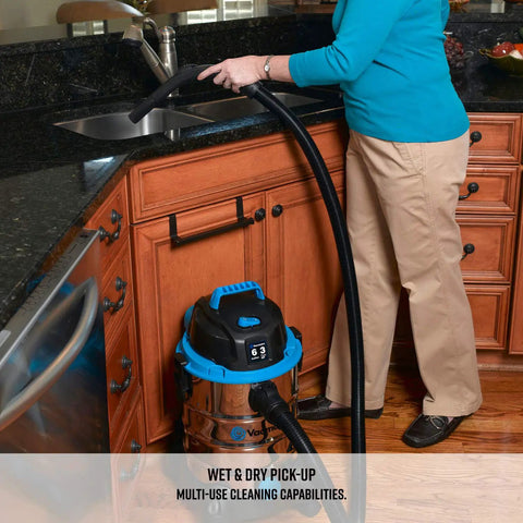 Person using Six Gallon Stainless Steel Wet and Dry Shop Vacuum With 3 Peak HP Motor for kitchen cleanup