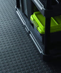 Close-up of black Interlocking 18 By 18 Inch Raised Coin Floor Tiles For Home Gym Garage Basement Black 24 Pack Durable Plastic Flooring