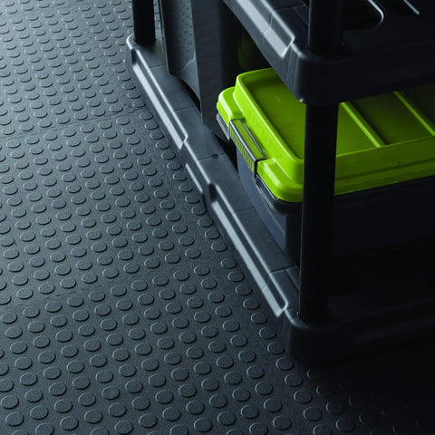 Close-up of black Interlocking 18 By 18 Inch Raised Coin Floor Tiles For Home Gym Garage Basement Black 24 Pack Durable Plastic Flooring