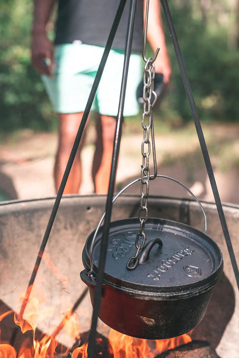 Rugged Heavy Duty Steel Camping Tripod For Open Fire Cooking 43.3 Inch Tall with Dutch oven suspended over fire