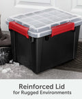Rugged 5 Gallon Waterproof Storage Bin With Tight Gasket Seal And Heavy Duty Latches next to winter boots on a snowy surface.