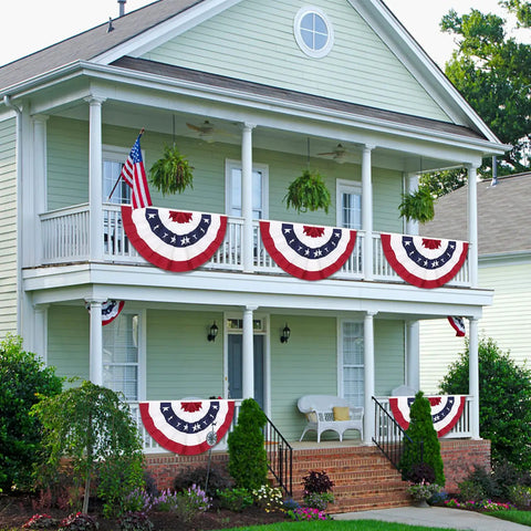 Totally Patriotic 3x6 Ft Pleated Fan Flags Set Of 4 For Fourth Of July And Memorial Day Durable Polyester With Brass Grommets Easy To Hang Half Fan Bunting For 250th Anniversary Celebrations adorning a two-story porch