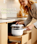 Woman placing Electric Hot Pot With Steamer 2L Nonstick Saute Pan 5 In 1 Cooker in kitchen drawer