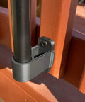Tiki Torch Deck Or Fence Mount Kit Black For Three Quarter Inch And One Inch Poles installed on outdoor railing