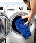 Heavy Duty Commercial Dust Mop Replacement Head Built Like A Tank With Dense Cotton Nylon Strands Runs Slick On Any Surface Industrial Janitorial Refill Universal 60 Inch Frame Takes Care Of Business Blue being placed into a washing machine.