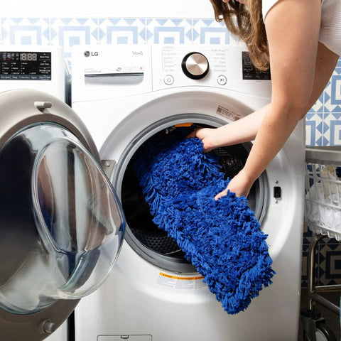 Heavy Duty Commercial Dust Mop Replacement Head Built Like A Tank With Dense Cotton Nylon Strands Runs Slick On Any Surface Industrial Janitorial Refill Universal 60 Inch Frame Takes Care Of Business Blue being placed into a washing machine.