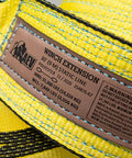 Label on Full Size Winch Extension Strap Four Inch By Thirty Foot Polyester Webbing With Reinforced Eyelets Tough Built To Last Off Road Recovery Gear Built For Real World Use 31,360 Lbs Minimum Breaking Strength
