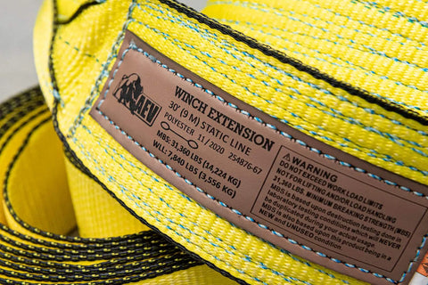 Label on Full Size Winch Extension Strap Four Inch By Thirty Foot Polyester Webbing With Reinforced Eyelets Tough Built To Last Off Road Recovery Gear Built For Real World Use 31,360 Lbs Minimum Breaking Strength