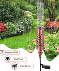 Solar Powered Rain Gauge With LED Night Light Outdoor Garden Stake Decoration 7 Inch Plastic Tube Freeze Proof Copper Metal Finish Brown Yard Gauge for Lawn and Weather Tracking in garden setting.