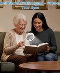 Crystal Clear Lighted Handheld Magnifier With 12 LEDs For Seniors used by elderly woman reading book on sofa