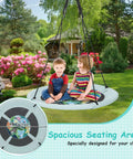 Children on 40 Inch Saucer Tree Swing For Kids With Carabiners, Adjustable Hanging Ropes From 55 To 71 Inches, Weatherproof 600D Oxford Cloth Seat in backyard