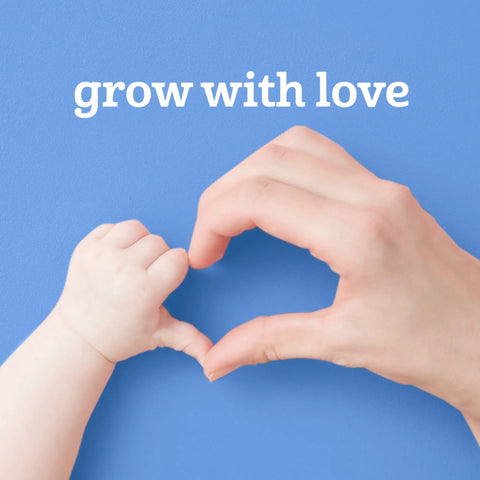 Baby hand and adult hand making heart shape with 'grow with love' text on blue background.