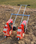 Hand Push Garden Seeder With Fertilizer Applicator on soil, double row design, see-through hopper visible