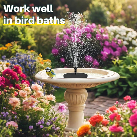 Solar Pond Fountain Pump 5.5W With Double Layer Nozzles installed in a bird bath surrounded by blooming flowers