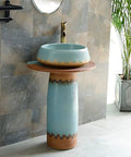 Killer Vintage Ceramic Pedestal Sink Slick Blue Hand Carved Washbasin with wooden top and textured porcelain base.