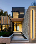 Modern home exterior with 2 Pack Long Outdoor LED Wall Lights 31.5 Inches, Modern Rectangular Black Wall Mount Fixtures, 24W IP65 Waterproof.