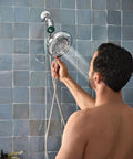 Quattro Handheld Shower System with Four Modes Relieve Soothe Clarify Cleanse Magnetix Dock Chrome Finish in use