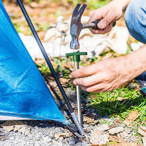Beefy Heavy Duty Galvanized Tent Stakes 10 Pack With Ropes For High Winds Rust Proof Ground Pegs securely hammered into ground