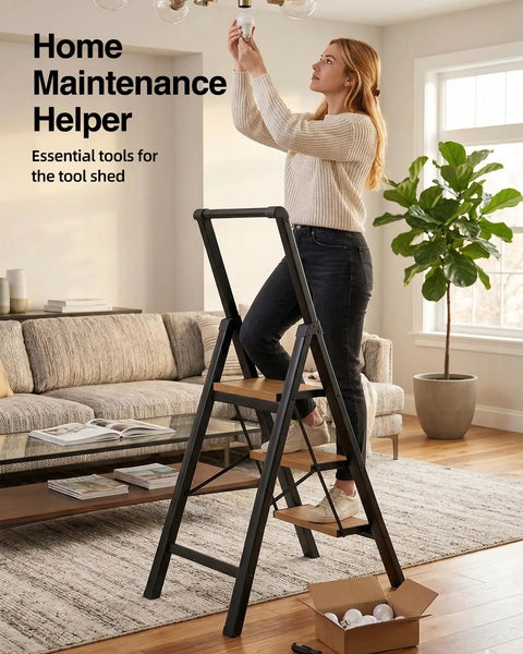 Three Step Folding Ladder With Anti Slip Wide Pedals And Handgrip, Aluminum Lightweight Steel Frame, 330 Lb Capacity For Home And Office, Black Woodgrain Finish, woman changing bulb