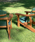 Classic Adirondack Chair Plans With Full Size Templates, two wooden chairs on grass, featuring green slats and brown frames.
