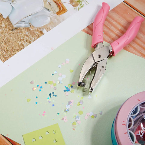 Three Piece Hole Punch Set With Circle Heart And Star Shapes Includes One Quarter Inch And Three Sixteenths Inch in action on paper.