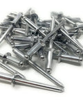 Aluminum Countersunk Blind Rivets 3/16 Inch Diameter Pop Rivets, 50 Count, shown scattered on a white surface.